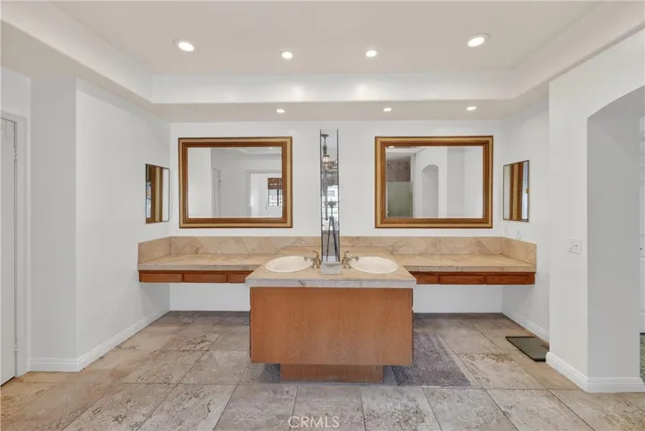 Main Floor Master Ensuite Bathroom with His/Hers Sinks and Vanity areas