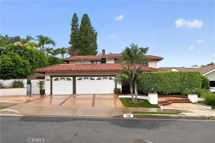 3 car garage with oversized driveway