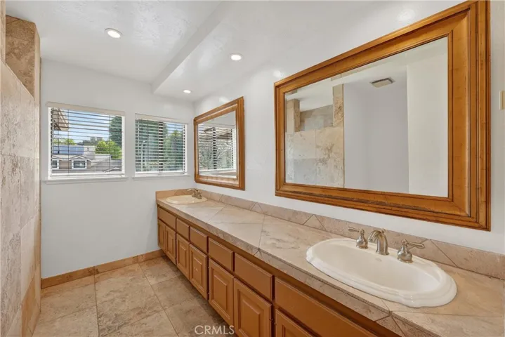Upstairs Bathroom with walk in shower, separate toilet area and double sinks