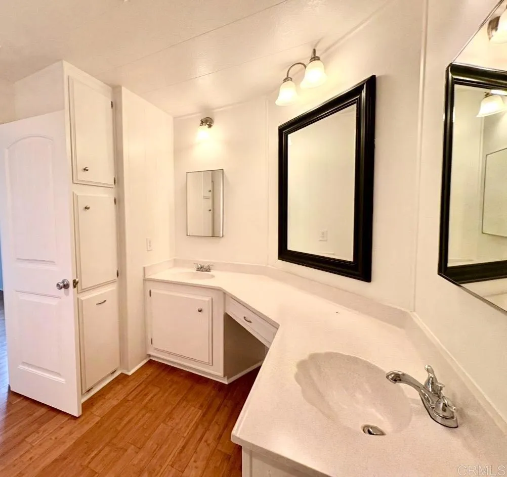 Primary with dual sink vanity and tub shower combo