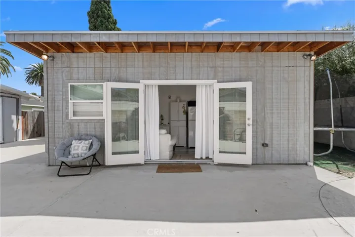 separate detached living space with a kitchen, bathroom, and room