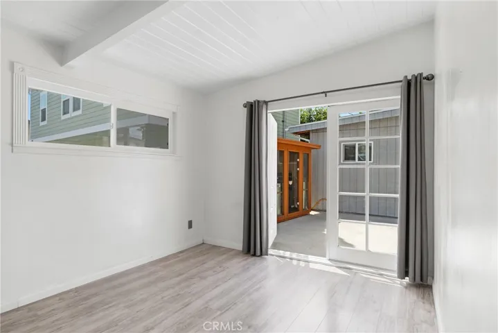bedroom one with french doors that open to back patio