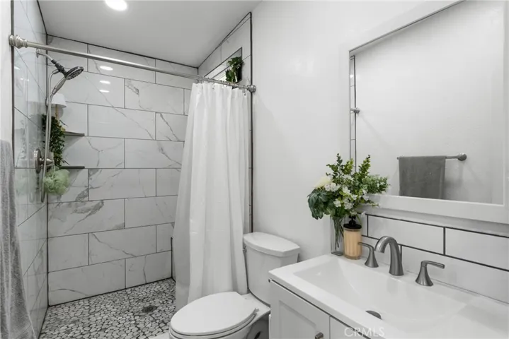 guest house unit with step in shower and vanity