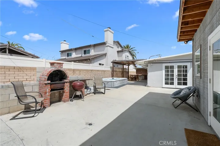 back patio with skate bowl, pizza oven, trampoline, sauna, covered awning