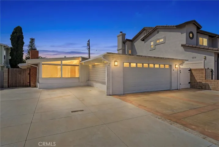 Front view of the property with extra parking in the driveway and in front of the house