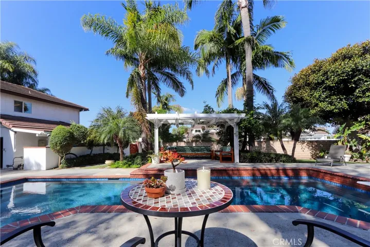 Private backyard retreat with multiple seating areas and resort-style amenities.