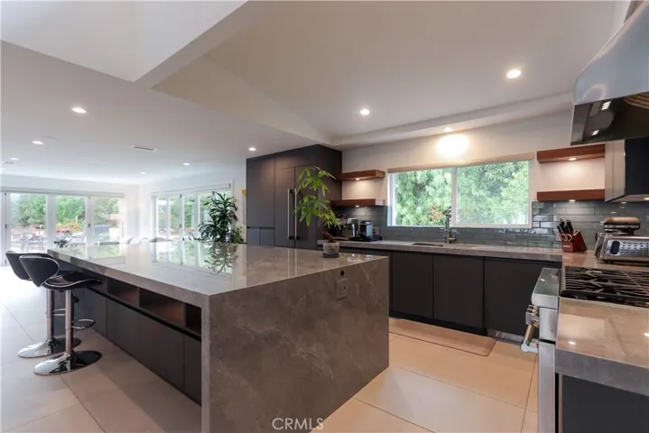 Fully remodeled chef’s kitchen with custom cabinetry and premium finishes