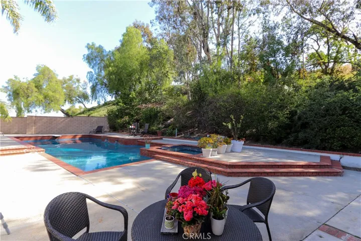 Generous pool layout with plenty of space for both relaxation and recreation.