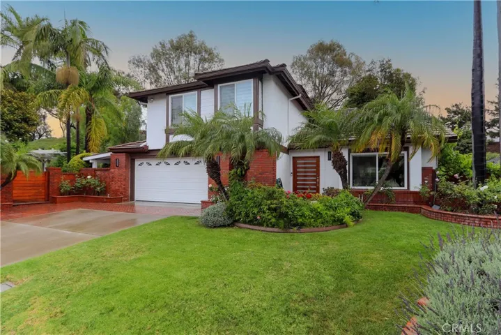 Beautifully upgraded home with stunning curb appeal and mature landscaping.