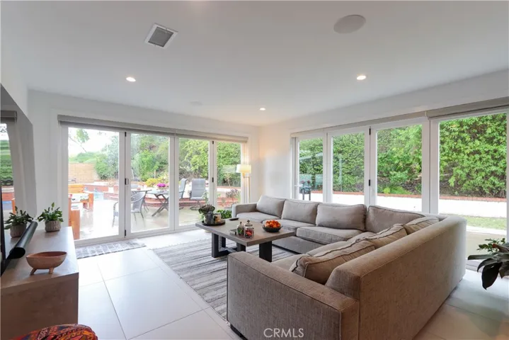 Open-concept living with seamless flow between kitchen, dining, and living spaces.