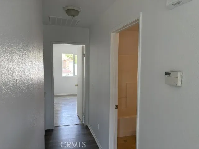 smaller hallway leading to 4th bedroom and 2nd bath
