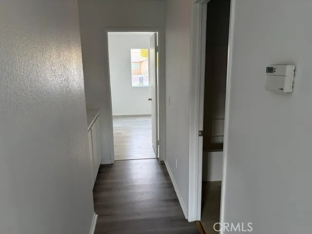 Another photo of smaller hallway leading to 4th bedroom and 2nd bath