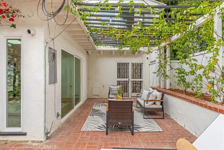 Vine covered patio perfect for relaxing on spring and summer days. Great location for a fire pit on fall and winter nights.