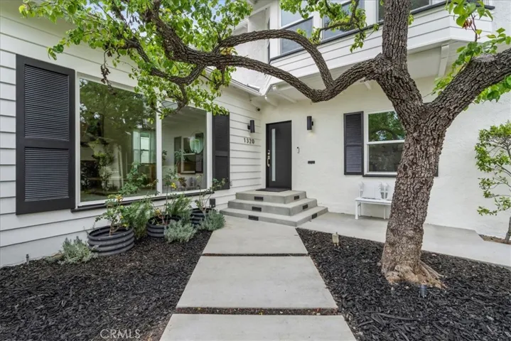 Front entry with large, shady tree