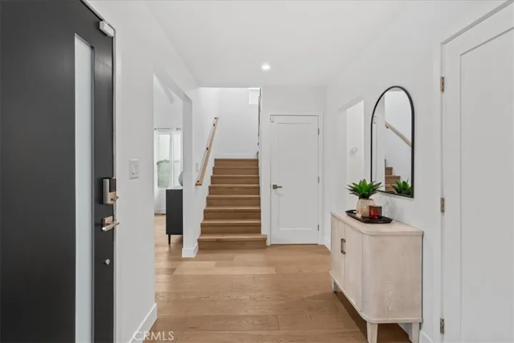 Foyer and second floor staircase leading to three bedrooms upstairs
