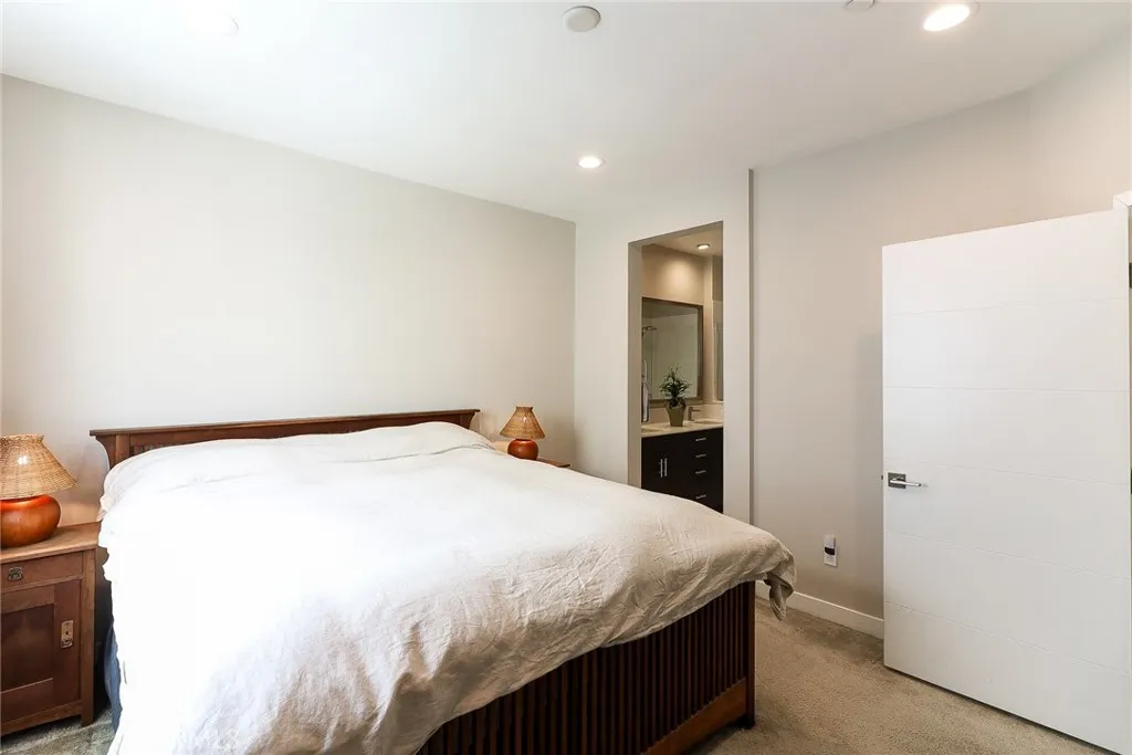 The main bedroom on the third floor is a bright and spacious area, complete with a modern and elegantly designed ensuite bathroom, offering both comfort and style.