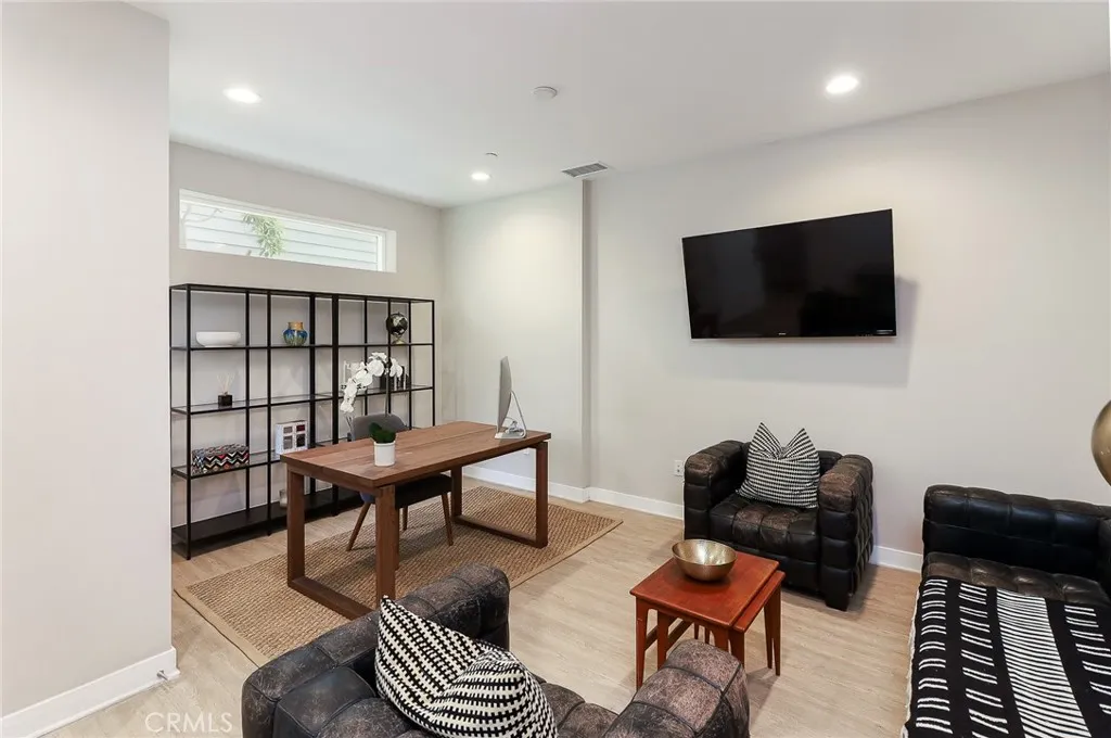 The first floor is now a study or office and can be converted to a 4th bedroom.
