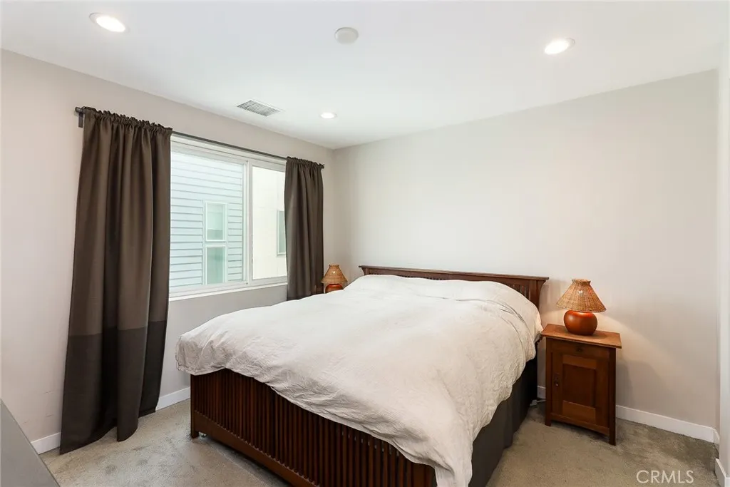 The main bedroom on the third floor is a bright and spacious area, complete with a modern and elegantly designed ensuite bathroom, offering both comfort and style.