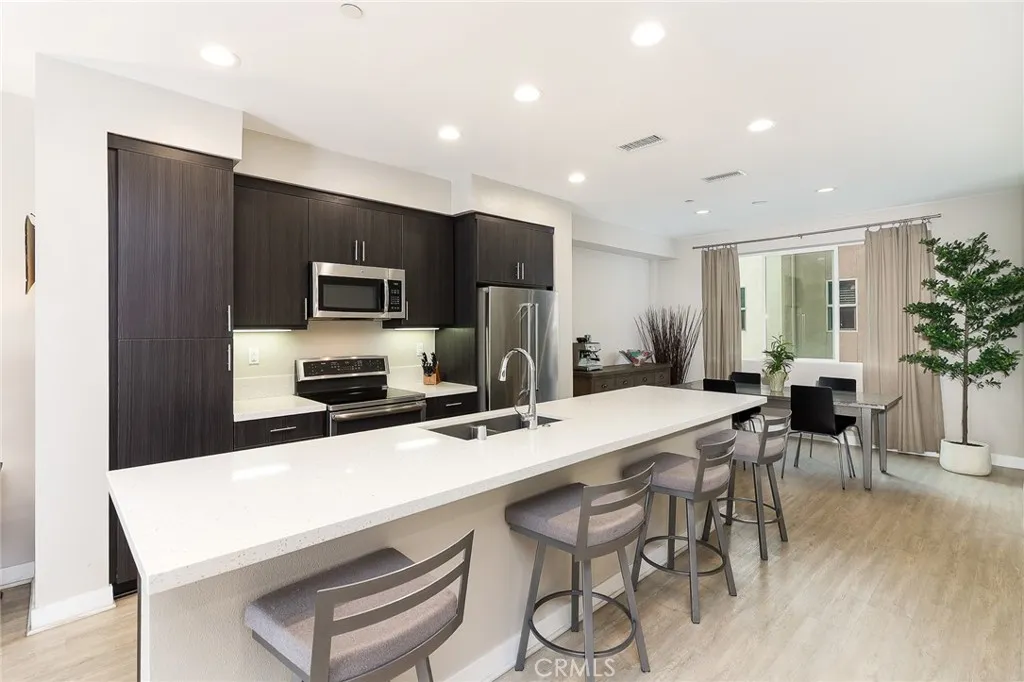 The chef's dream modern kitchen located on the 2nd floor. Note the quartz, huge kitchen island, and stainless steel appliances. Delight your guests and showcase your chef talents.