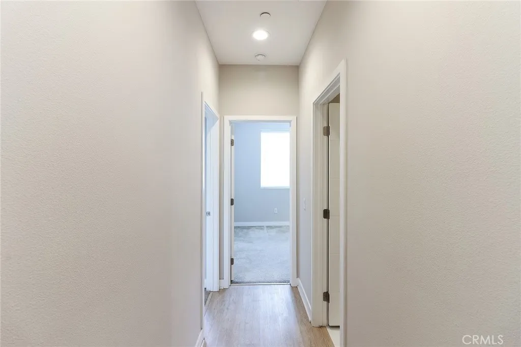 The spacious 3rd floor hallway, providing access to the bedrooms and the second full bathroom.
