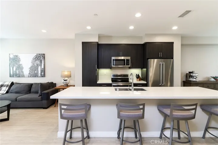Good-sized quartz kitchen island for meal preps and meal spreads for entertaining or feeding the hungries while the others are watching TV or lounging in the living room!