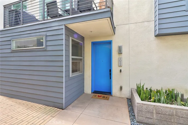 The warm and inviting front door is a perfect welcome, eagerly anticipating your arrival and ushering you into the heart of your new cherished residence!