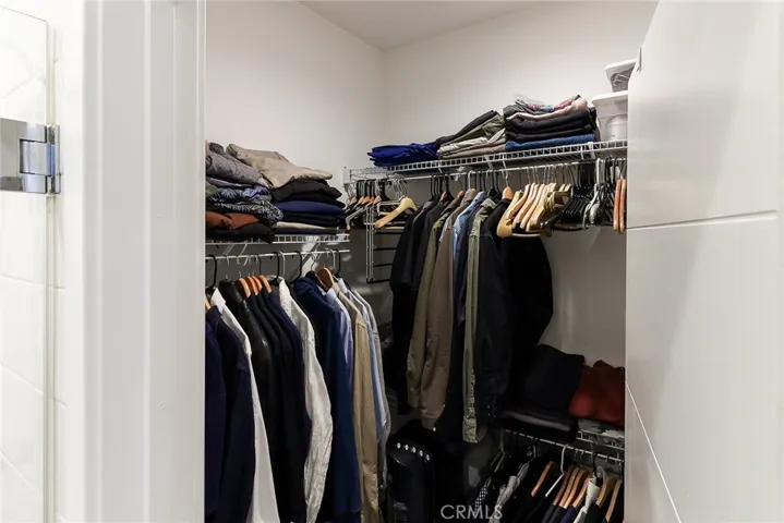 The walk in close of the main bedroom.  At the back of this closet door is the internet/communication hub of the home.