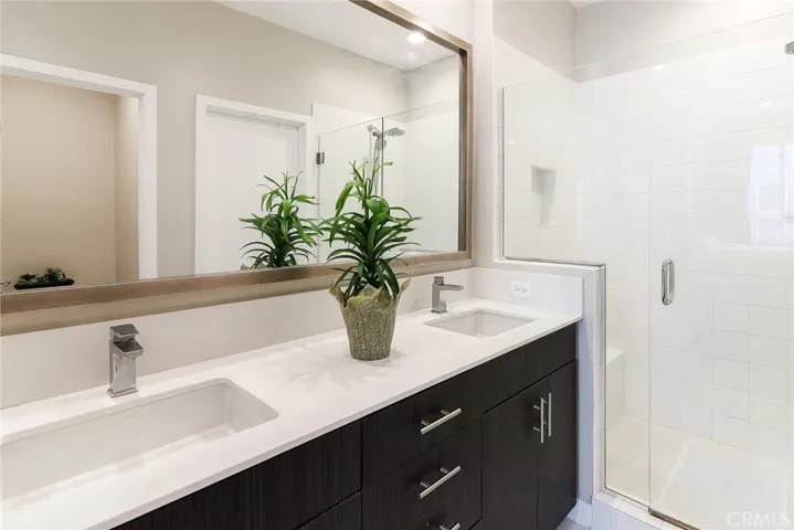 This main bath on the 3rd floor features stylish double sinks, providing ample convenience and space for daily routines.