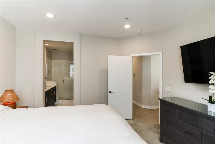 The main bedroom on the third floor is a bright and spacious area, complete with a modern and elegantly designed ensuite bathroom, offering both comfort and style.