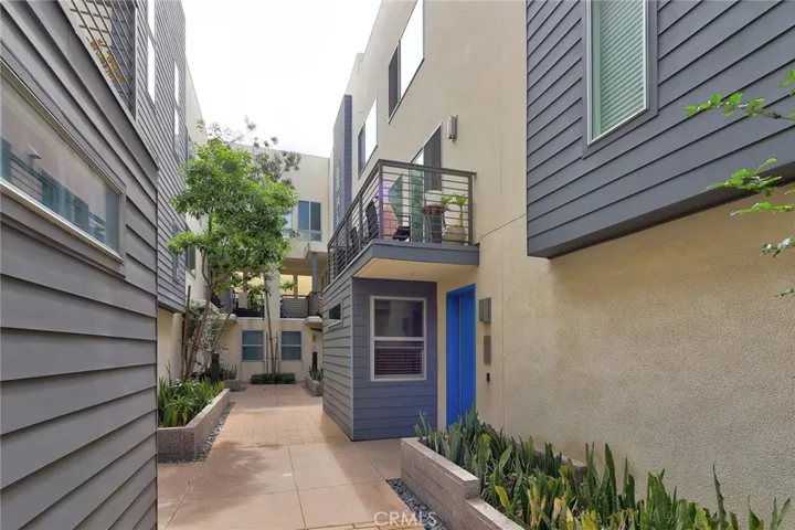 The warm and inviting front door is a perfect welcome, eagerly anticipating your arrival and ushering you into the heart of your new cherished residence!