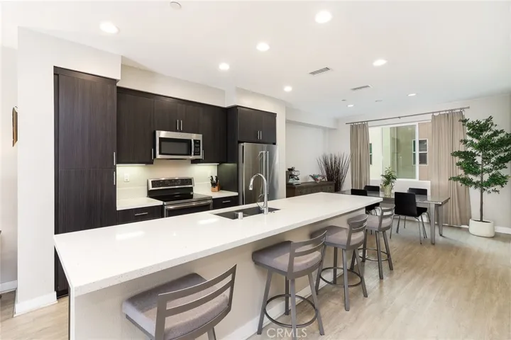 The chef's dream modern kitchen located on the 2nd floor. Note the quartz, huge kitchen island, and stainless steel appliances. Delight your guests and showcase your chef talents.