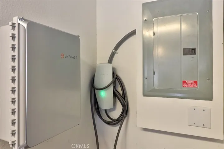 Equipped with a fully integrated Enphase solar system and dedicated Tesla charging station, this home delivers both efficiency and forward-thinking convenience.