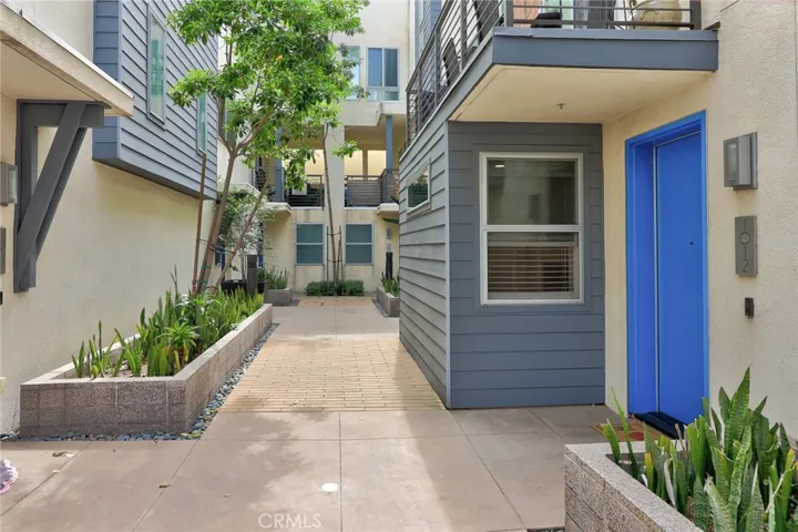 The warm and inviting front door is a perfect welcome, eagerly anticipating your arrival and ushering you into the heart of your new cherished residence!