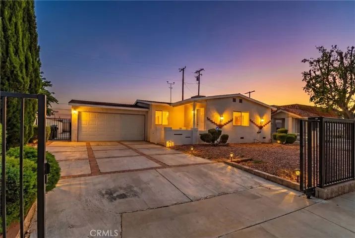 Photo altered/staged to add twilight setting and lighting on/in house