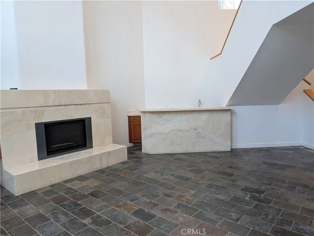 Lower level family room with fireplace and bar