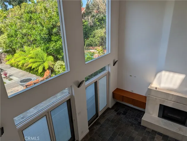 Sliding doors open from family room to incredible back yard with custom Koi Pond fountain and fire pit.