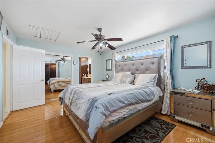 Master Bedroom view with Whole House Fan & towards bathroom