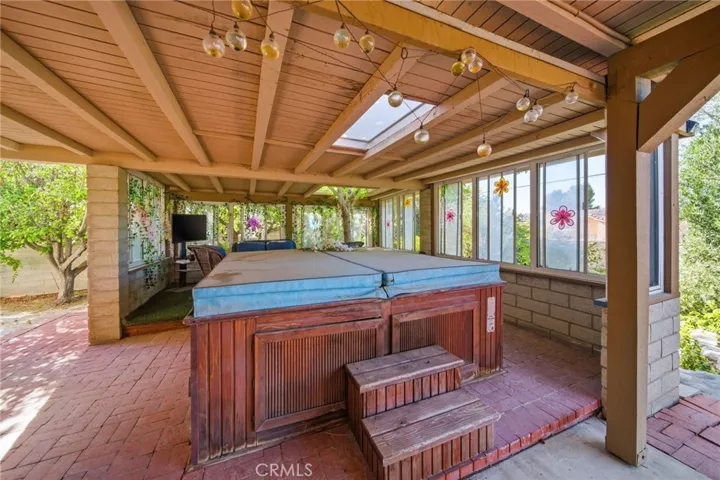 Covered Spa with skylight and Seating area of Arizona Room