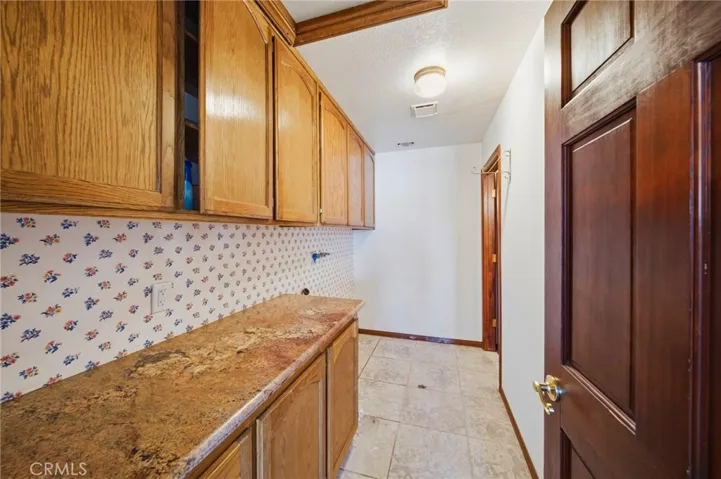 Laundry with tons of Cabinet Space