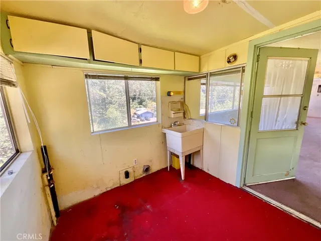 laundry room with utility sink