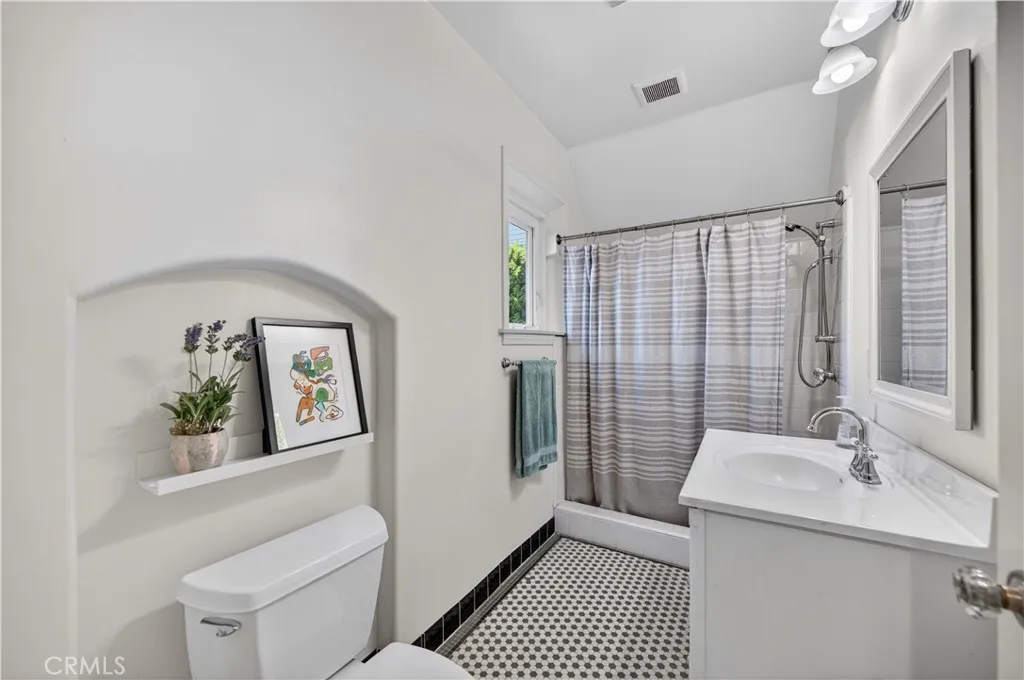 One of two vintage bathrooms located upstairs.