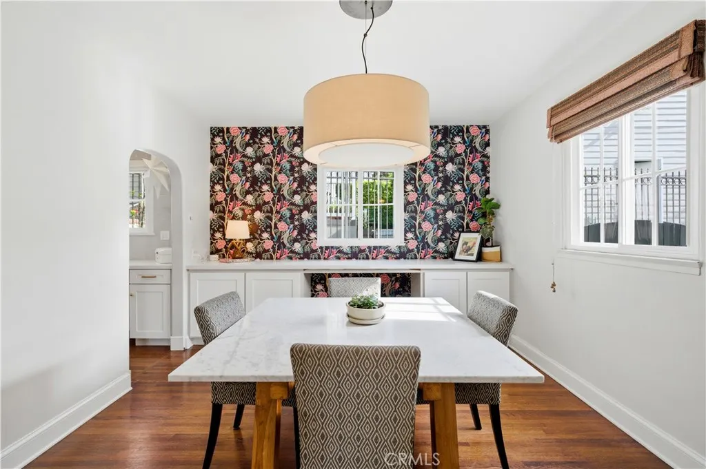 Designer wall paper and custom buffet makes this room a showpiece.