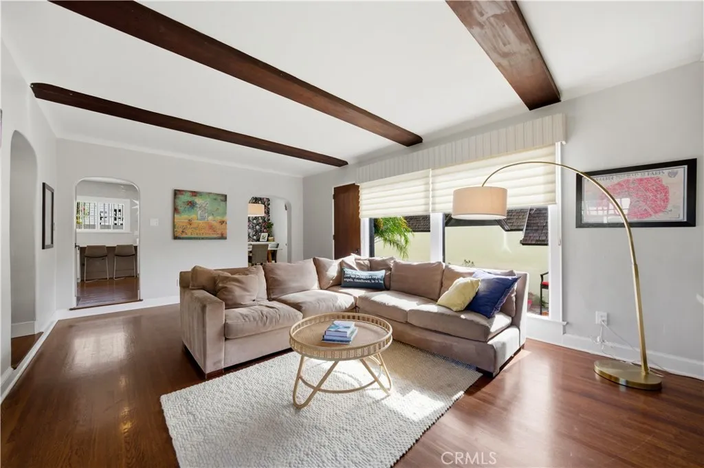Family room, with beamed ceiling, has direct access to the kitchen and dining room.