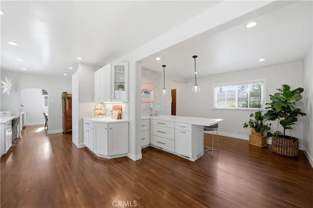 Wood floors can be found throughout the downstairs including the kitchen.