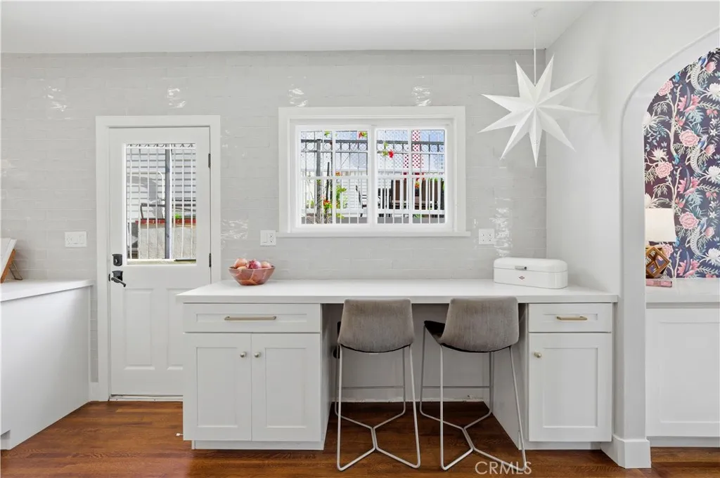 Breakfast nook is located in the this sunny kitchen.