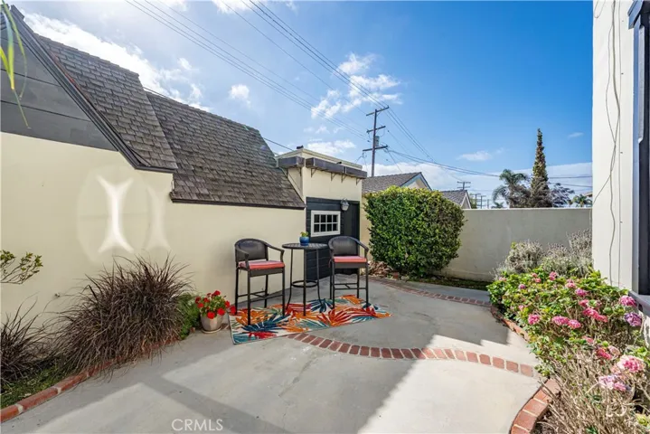 Private yard between the home and garages.