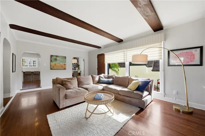 Family room, with beamed ceiling, has direct access to the kitchen and dining room.