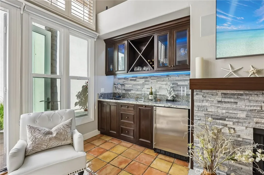 The Wine Bar has ample storage, a refigerator with icemake and sink.