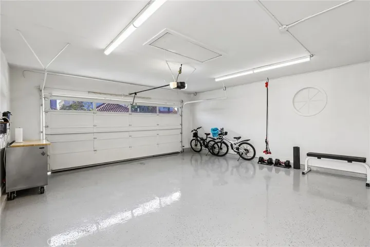 2 Car Garagewith hooks to hang bikes and extra room for gym equipment and tool cabinet or???