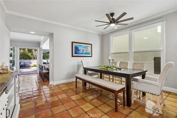 Enjoy seating for 8, a ceiling fan and space for a side board for an elegant dining experience.
